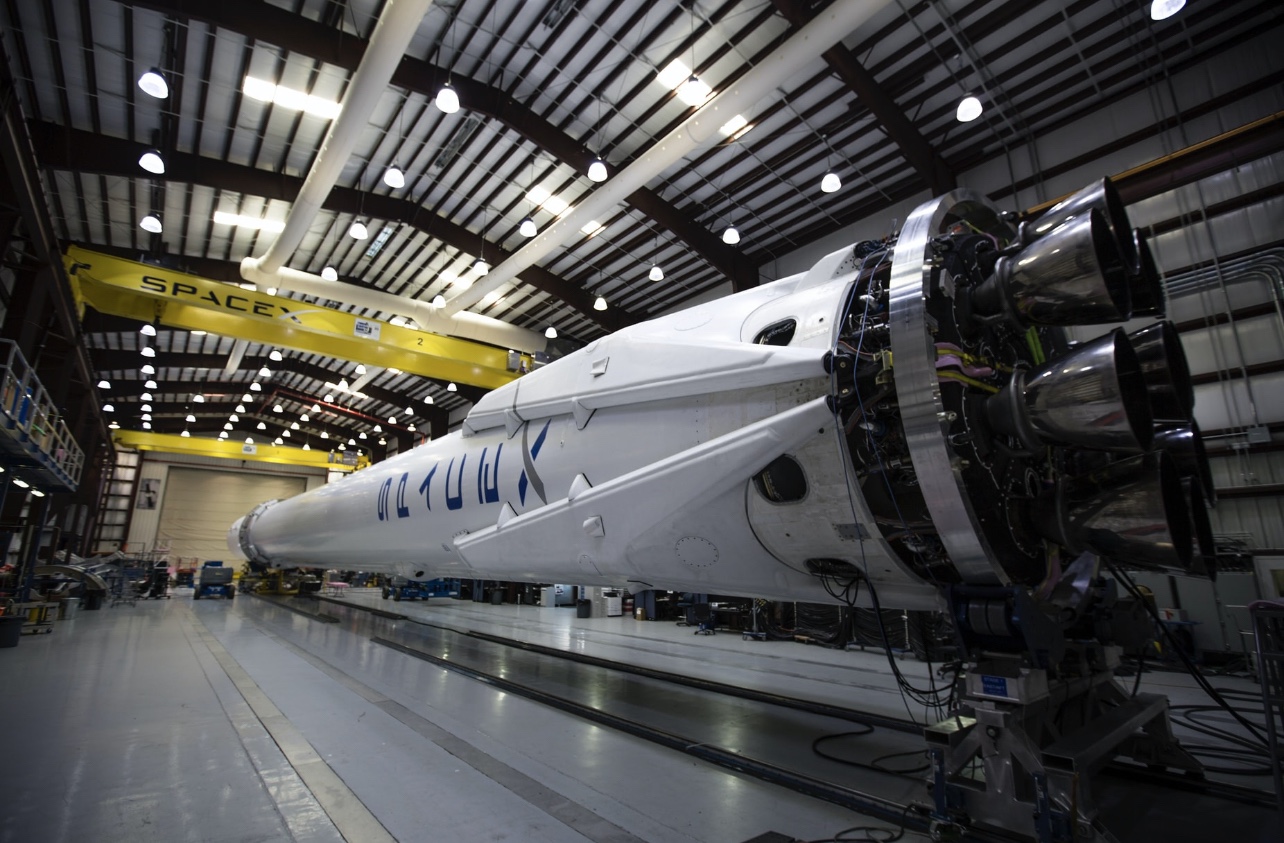 Space X rocket being built in a hanger fulfilling a deep purpose of Elon Musk’s life work. 